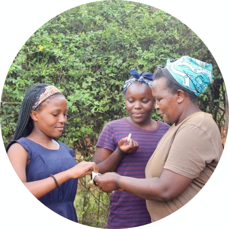 female farmers in kenya tasting macadamia chocolate